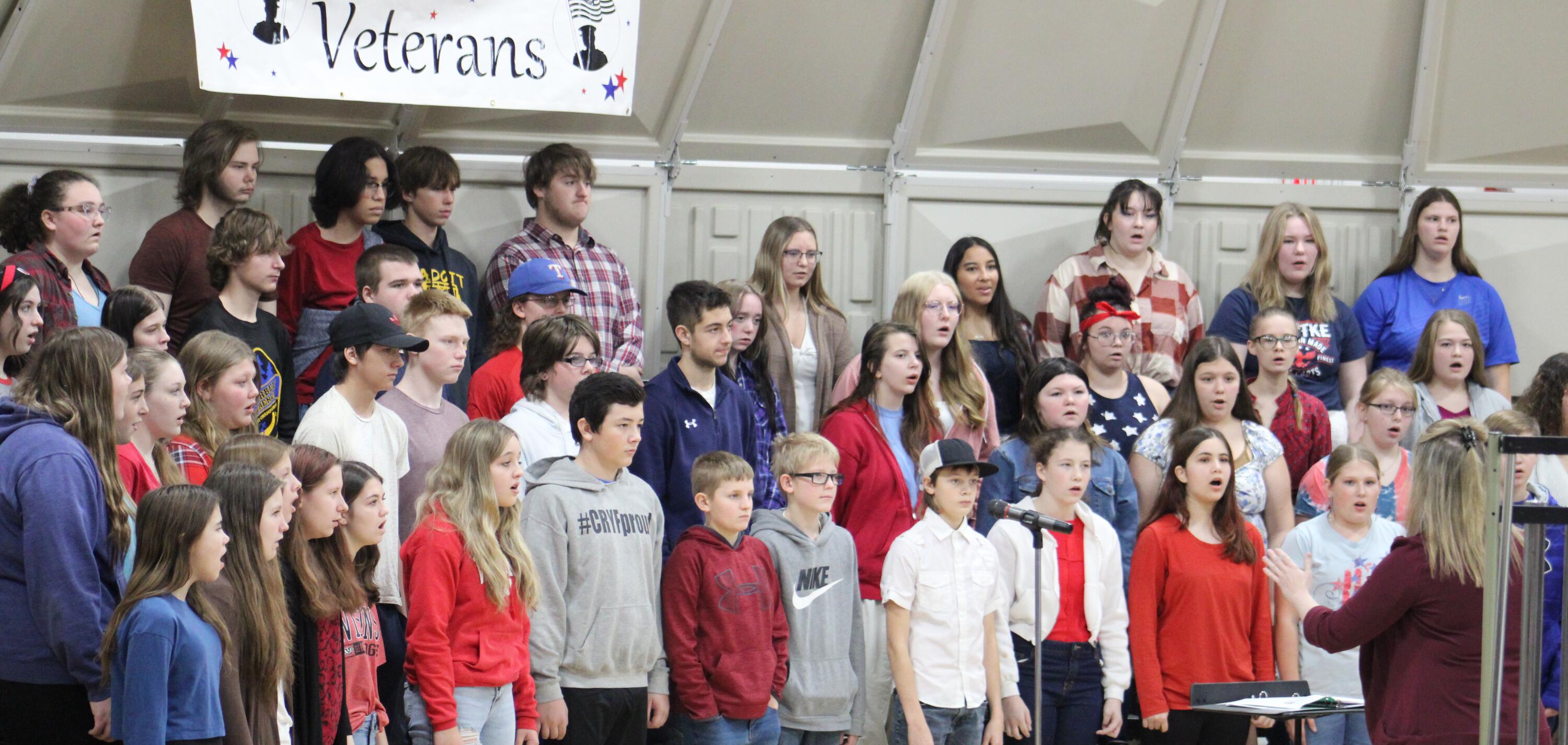Students singing during the Veteran's Day ceremony.